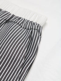 Close-up of a black and white striped fabric on a white background