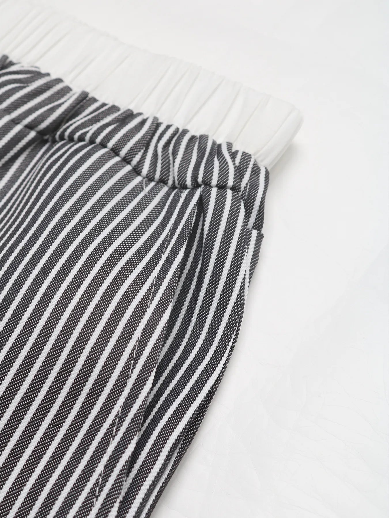 Close-up of a black and white striped fabric on a white background
