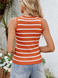 Person wearing a striped orange and white tank top with a blurred outdoor background
