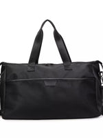 Black duffel bag on a white background