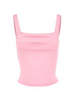 Pink crop top with thin straps on a white background