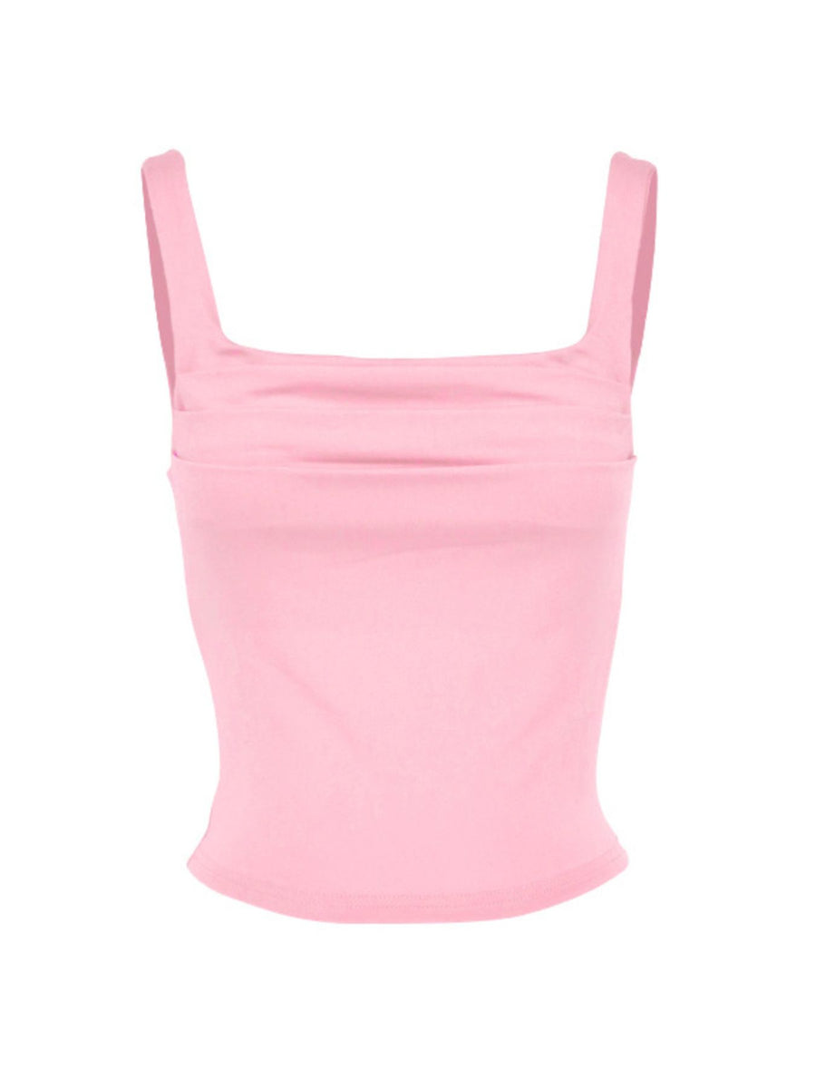 Pink crop top with thin straps on a white background