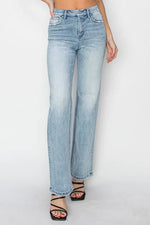 Light blue jeans worn by a person on a white background