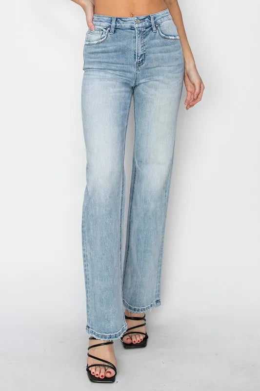 Light blue jeans worn by a person on a white background