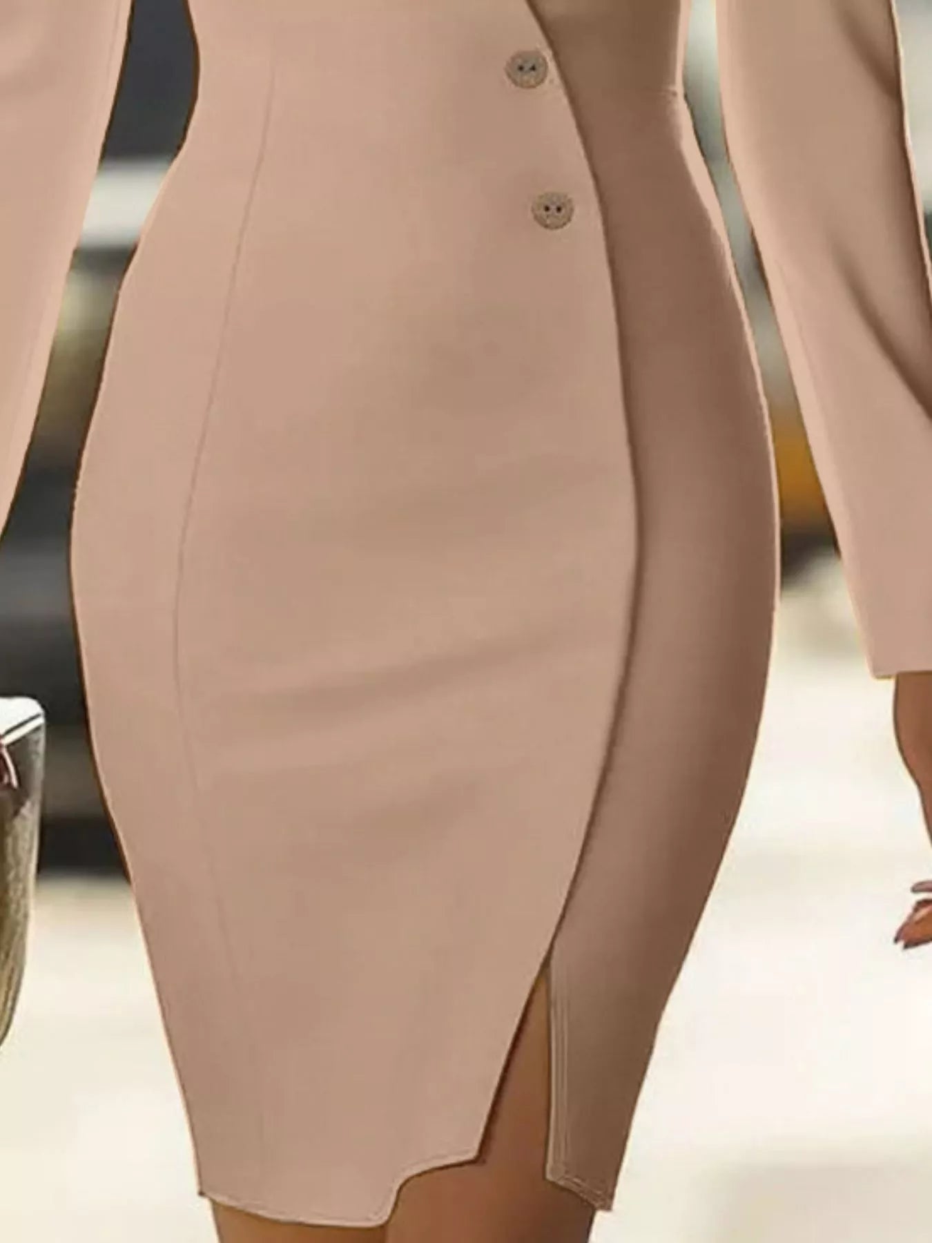 Close-up of a beige pencil skirt with a blurred background