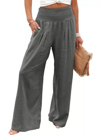 Gray wide-leg pants worn by a person on a white background