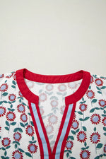 Floral patterned garment with red trim on a plain background