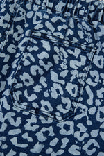 Close-up of blue denim fabric with a subtle pattern