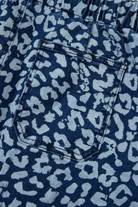 Close-up of blue denim fabric with a subtle pattern