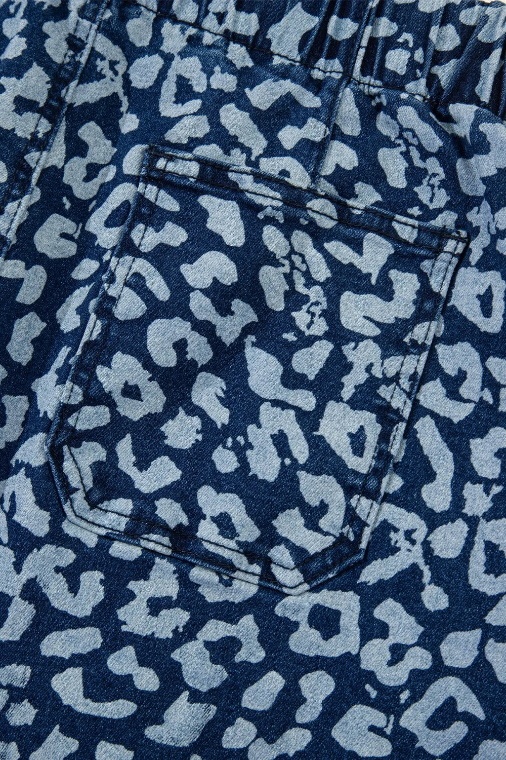 Close-up of blue denim fabric with a subtle pattern