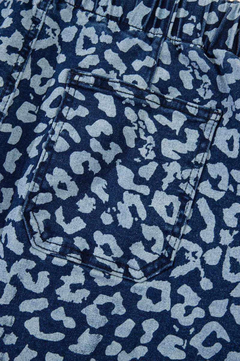 Close-up of blue denim fabric with a subtle pattern