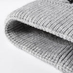 Close-up of a textured gray rug on a white background