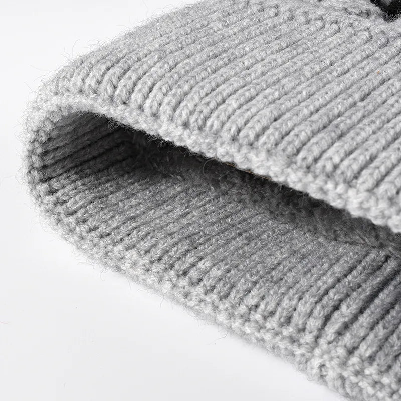 Close-up of a textured gray rug on a white background