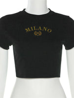 Black crop top with 'MILANO' text on a mannequin against a white background