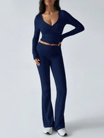 Woman wearing a navy blue outfit on a white background