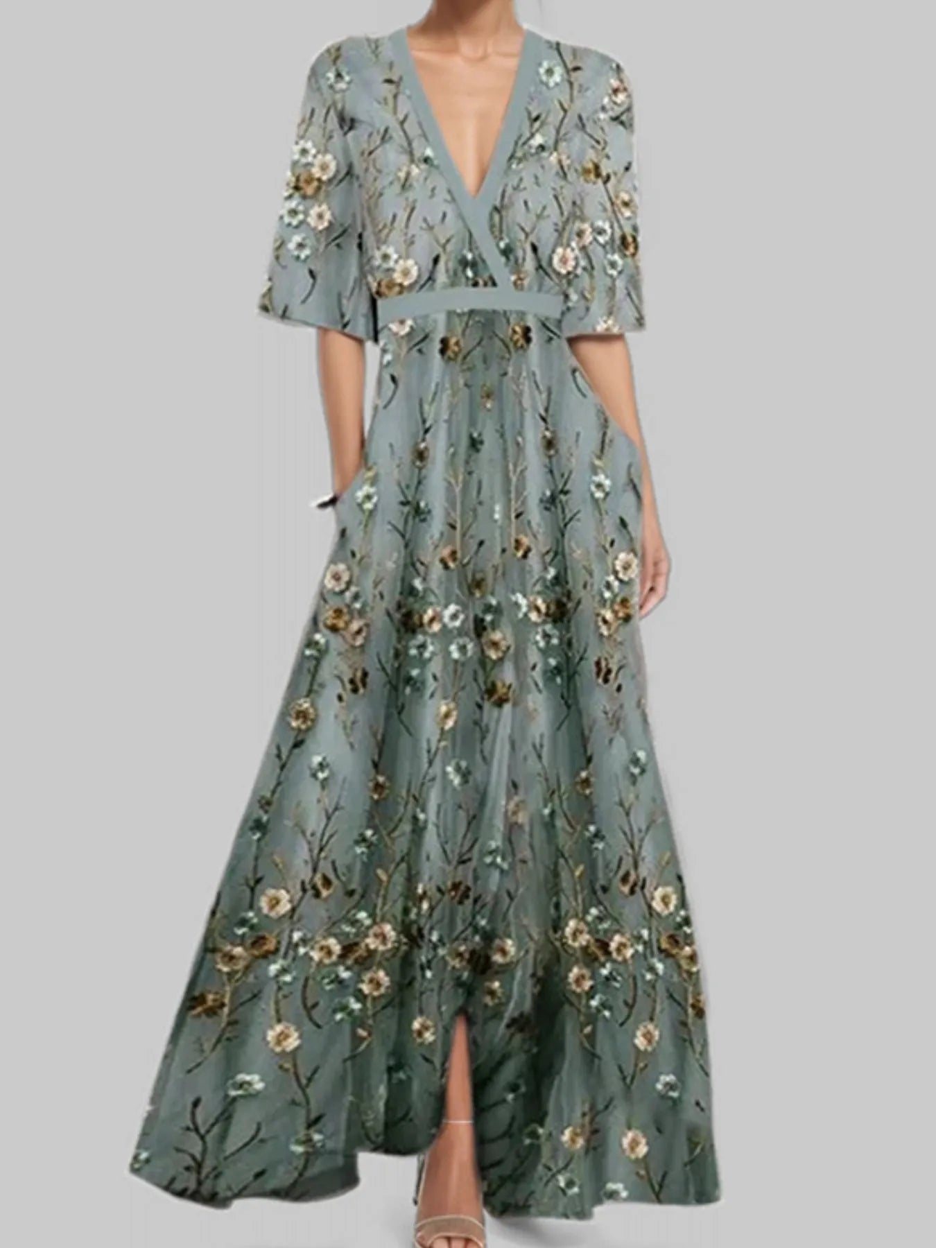 Green floral dress on a gray background