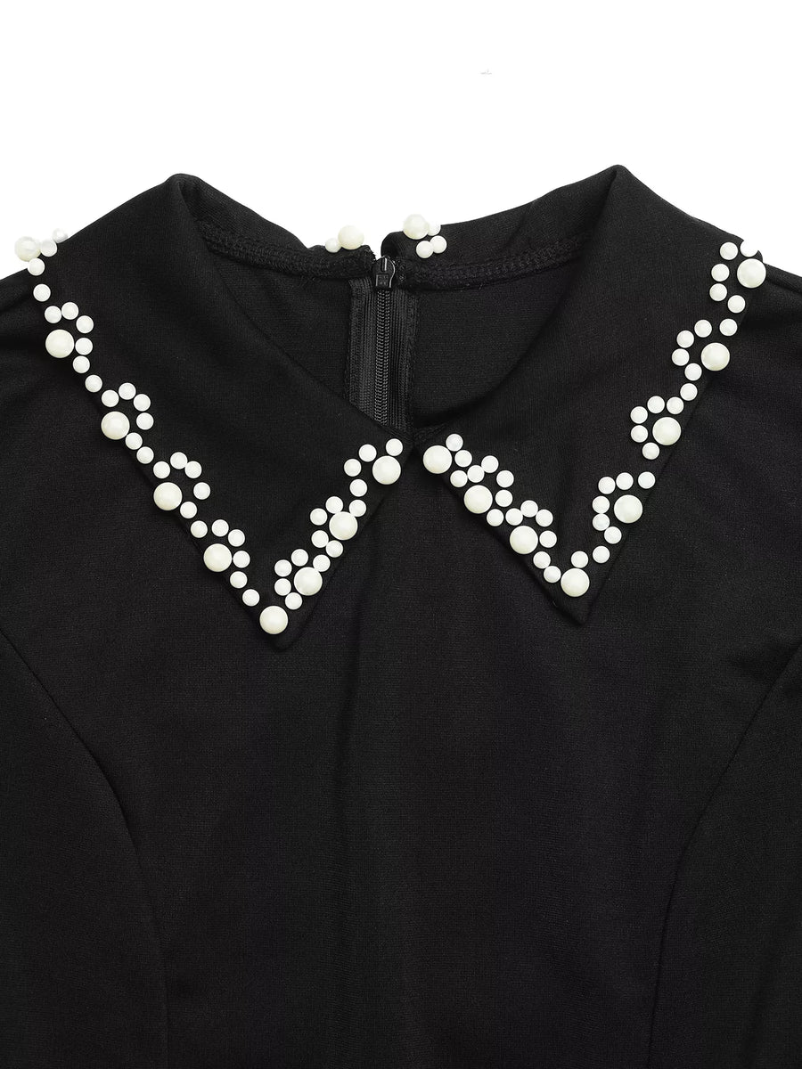 Black garment with a decorative white pearl collar on a white background
