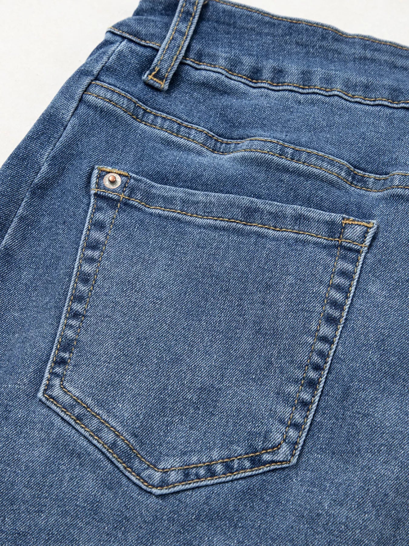 Close-up of a blue denim pocket on jeans