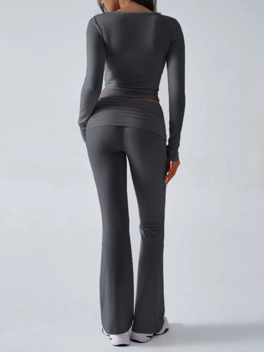 Person wearing a gray athletic outfit on a white background