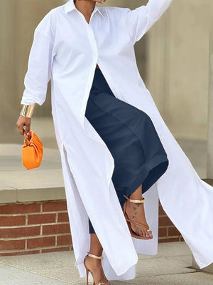 Person wearing a white shirt and navy skirt with an orange clutch and gold sandals.