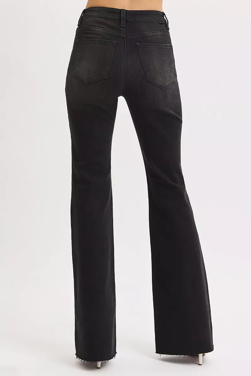 Black flared jeans on a white background
