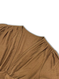 Brown dress with a V-neckline on a white background