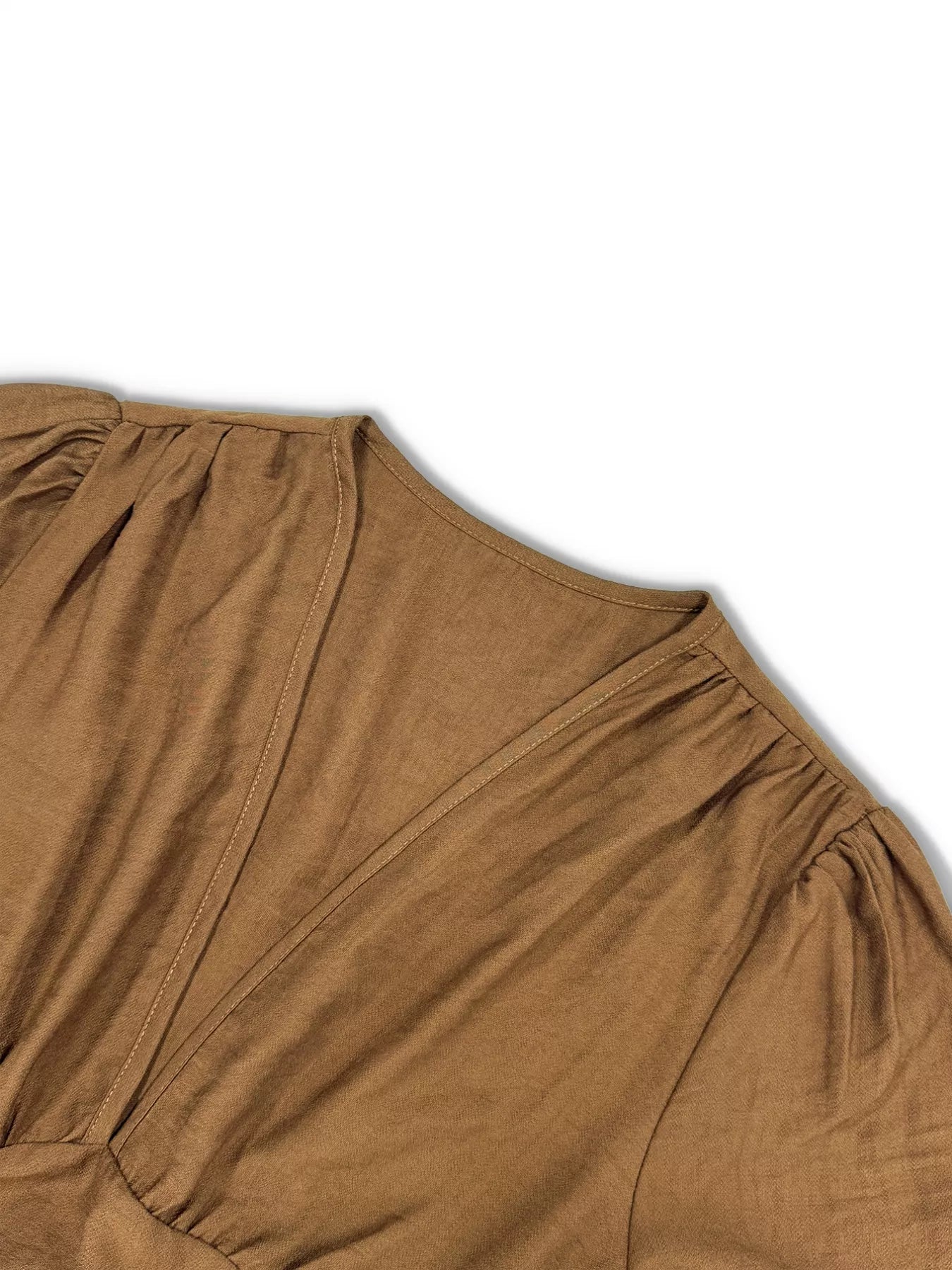 Brown dress with a V-neckline on a white background