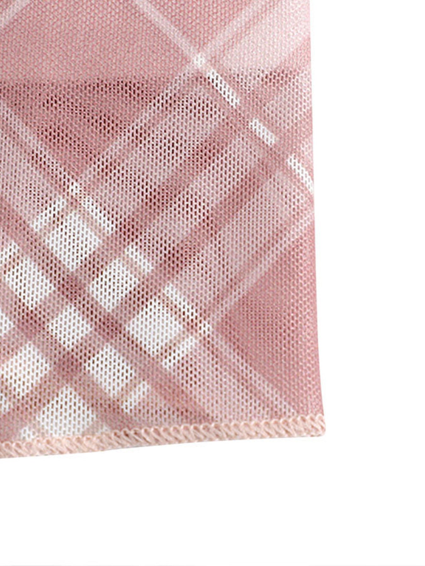 Close-up of a pink checkered fabric with a white background
