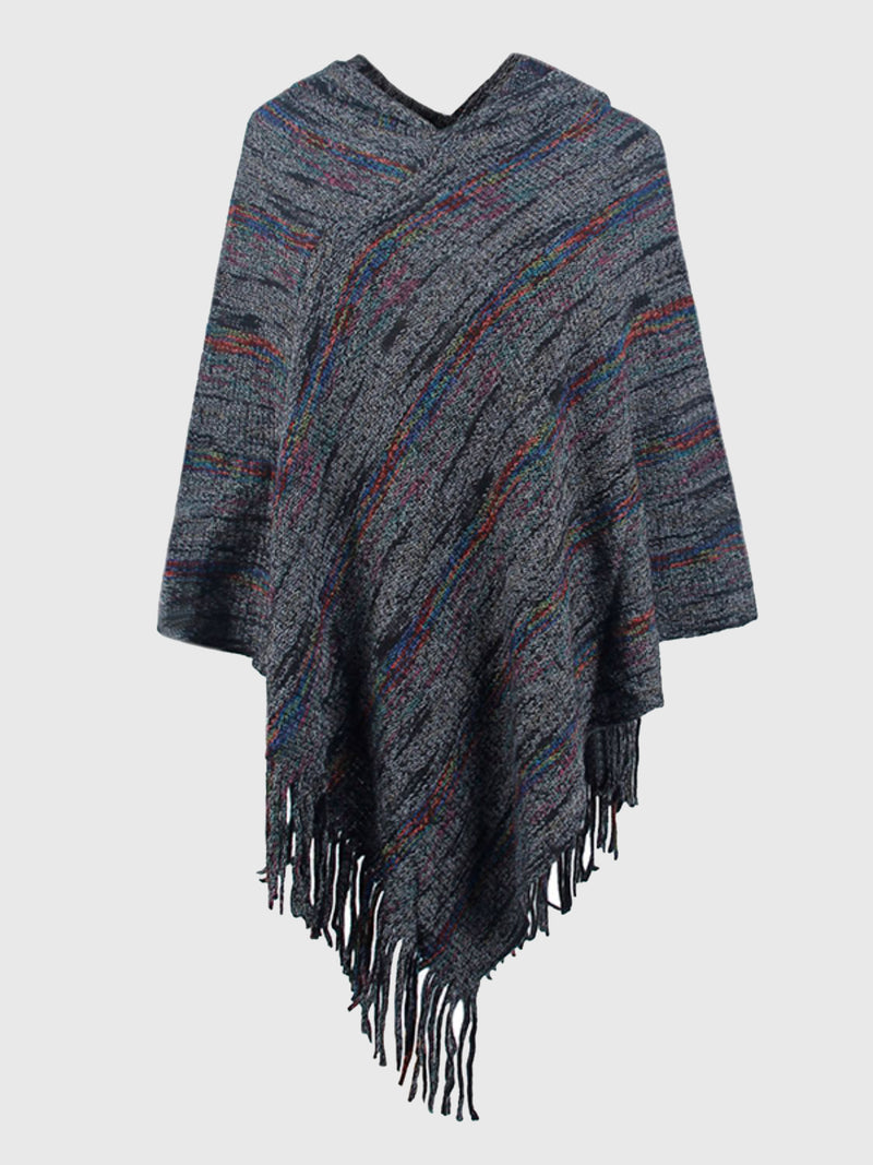 Textured poncho with fringes on a light gray background