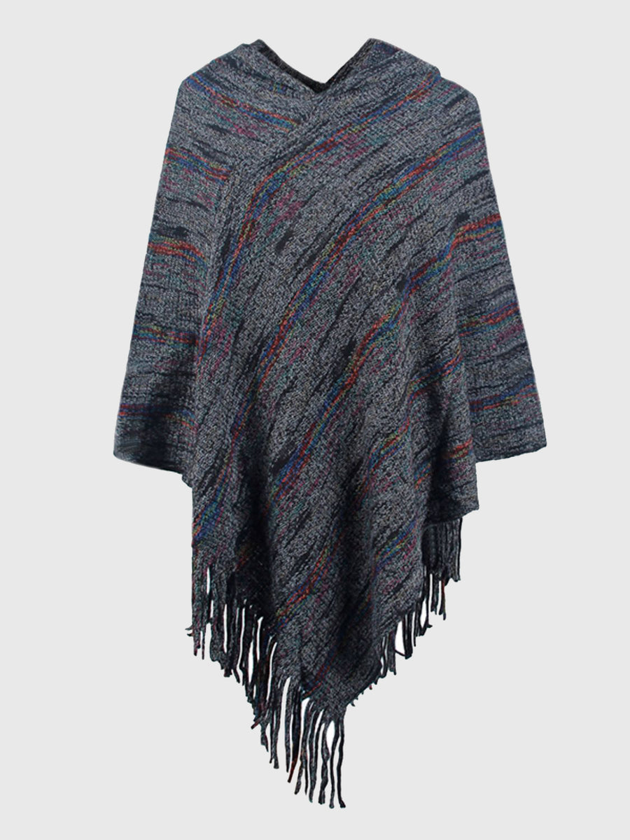 Textured poncho with fringes on a light gray background
