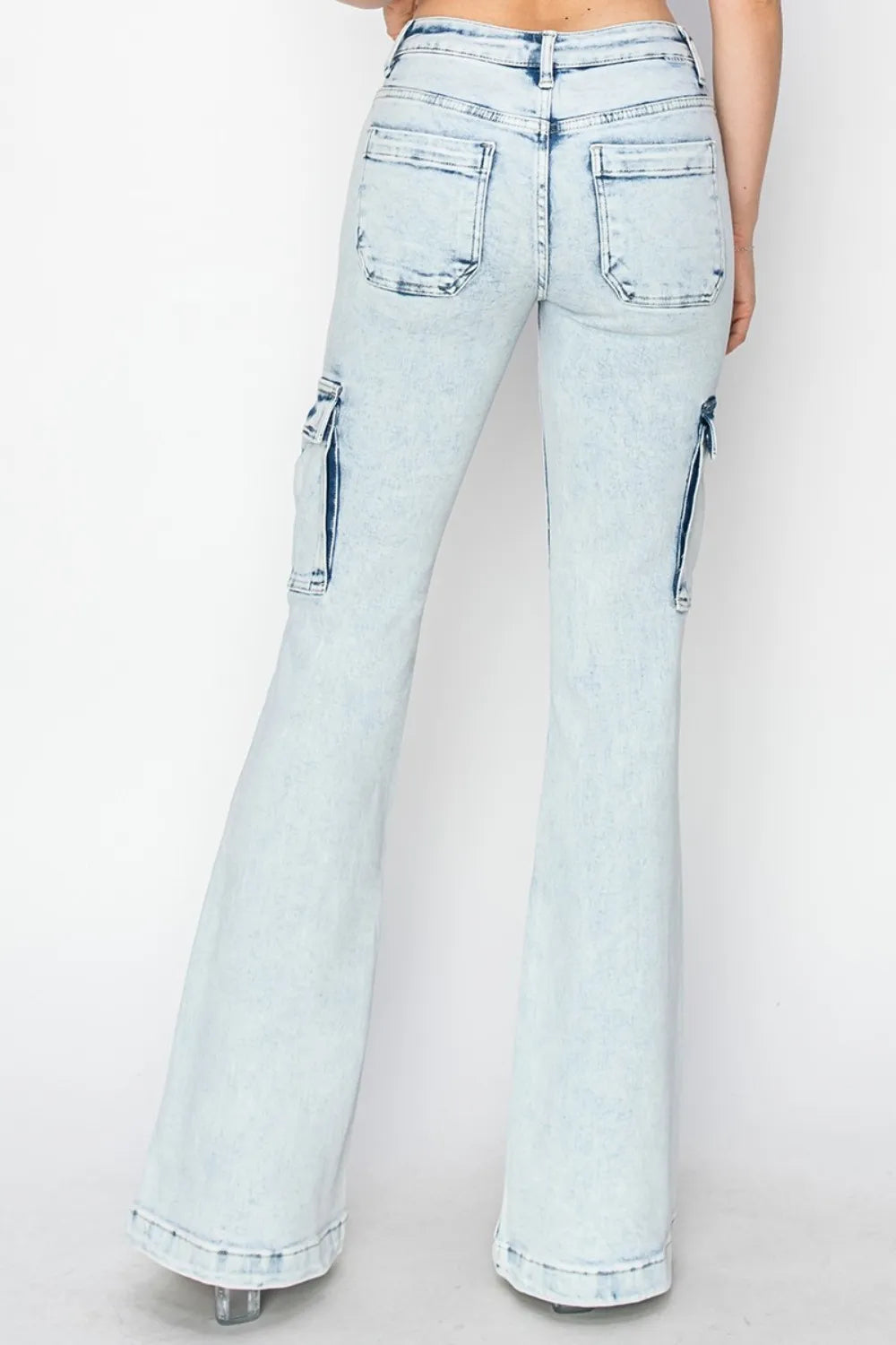 Light blue flared jeans on a white background