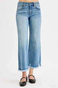 Light blue jeans worn by a person on a white background