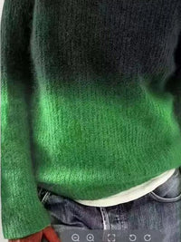 Green and black gradient sweater worn by a person, with a focus on the sweater's color transition.