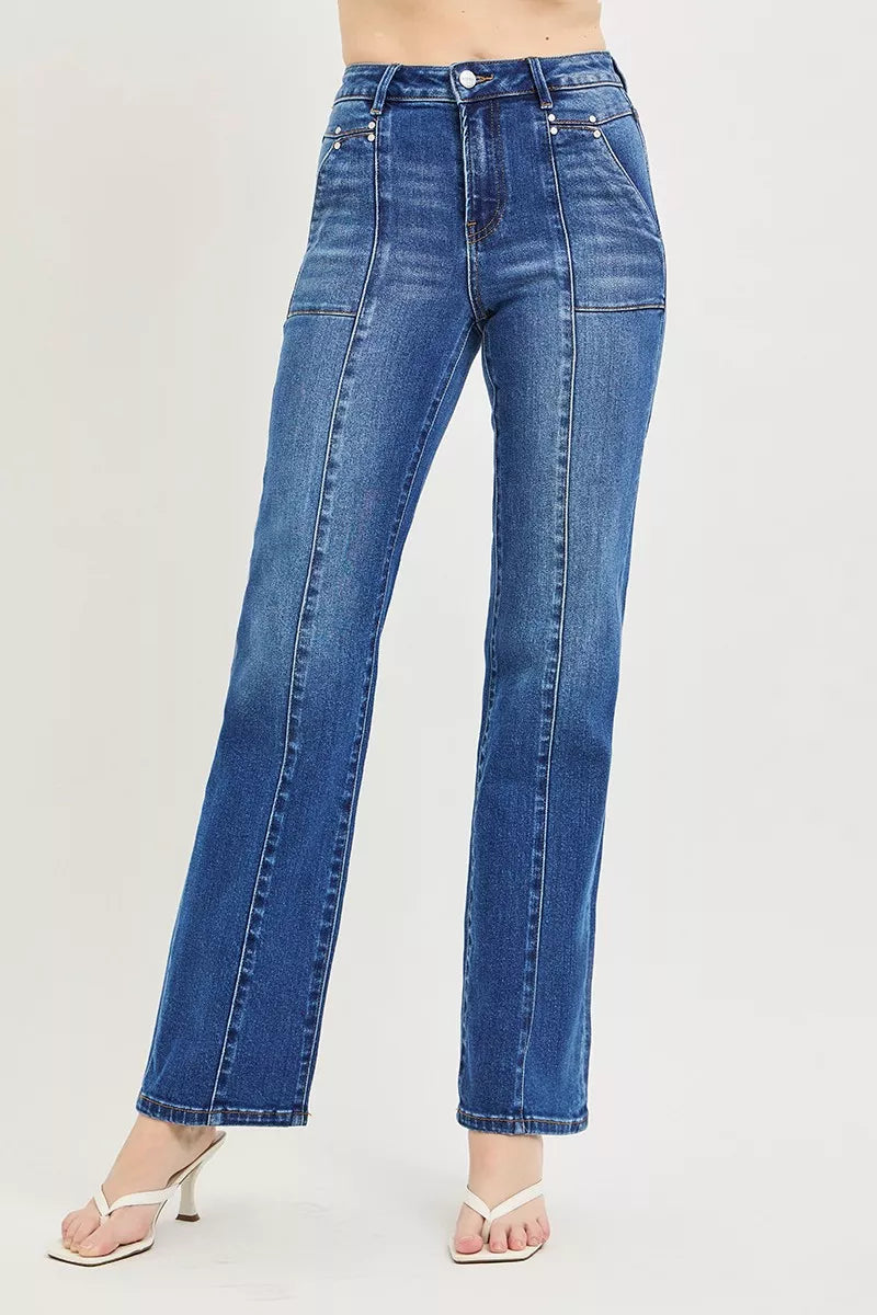 Blue jeans worn by a person on a light gray background