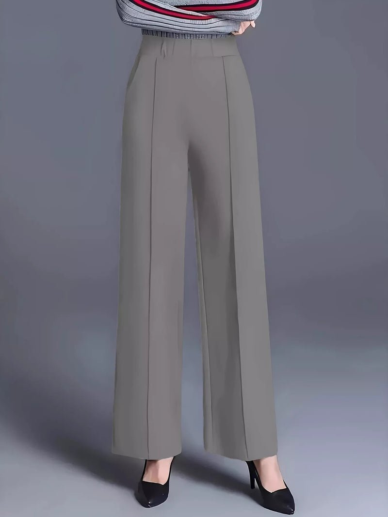 Gray wide-leg pants worn by a person on a gray background
