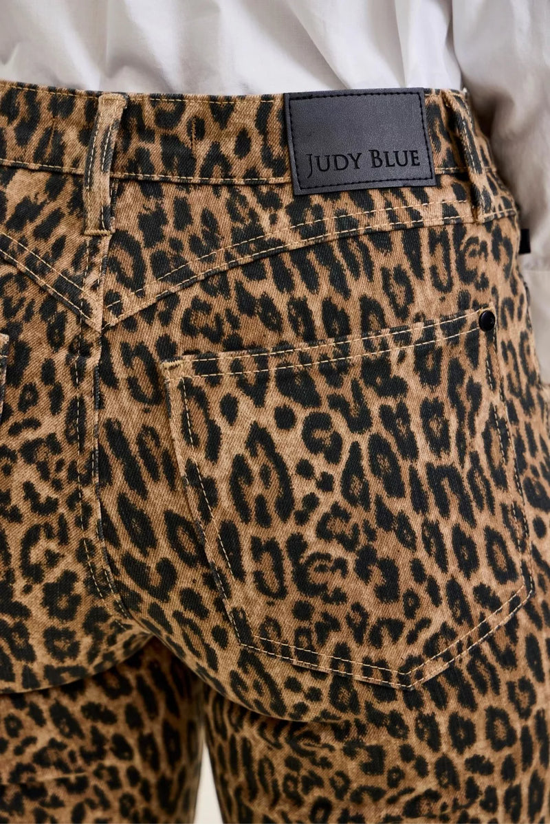 Leopard print pants with a Judy Blue label on a plain background