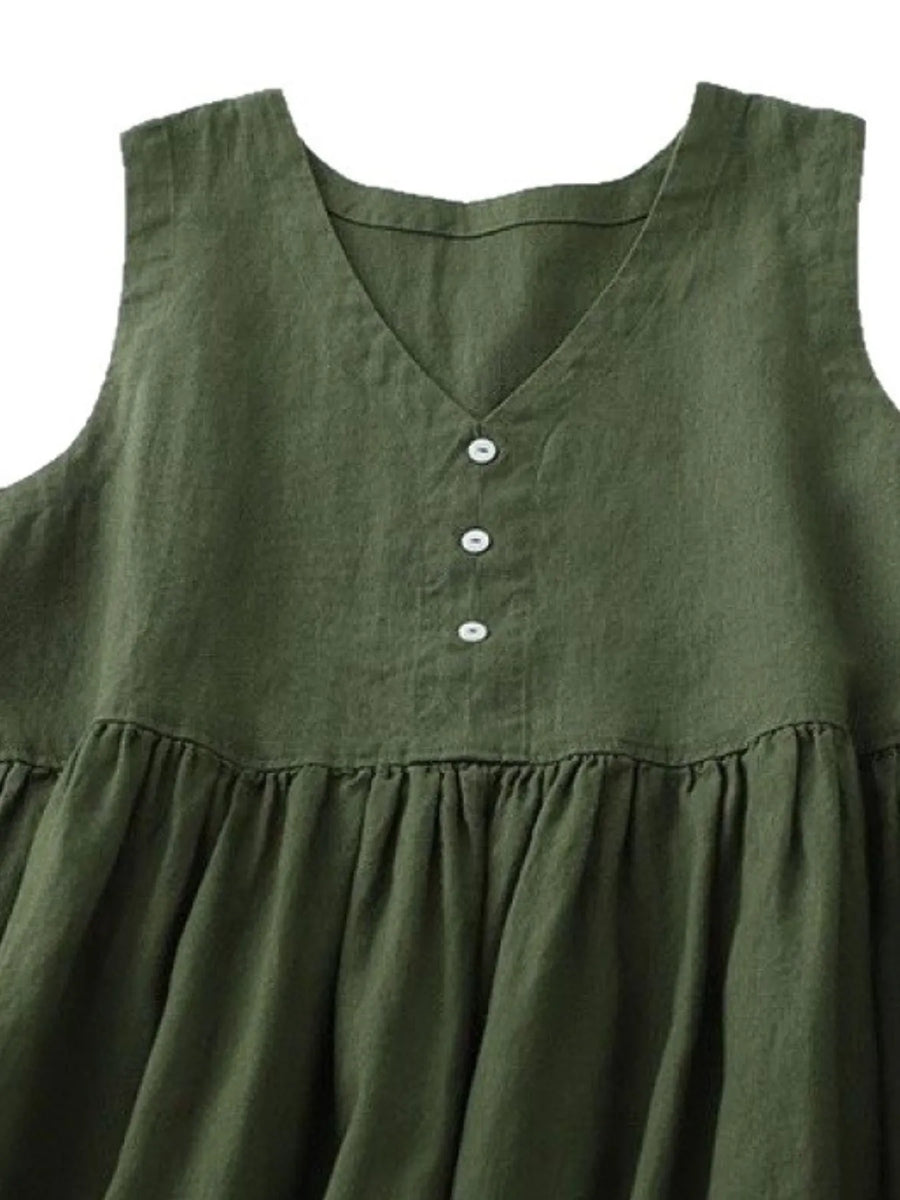 Green sleeveless dress with button details on a white background