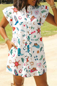 Woman wearing a colorful patterned dress with graphics and text.