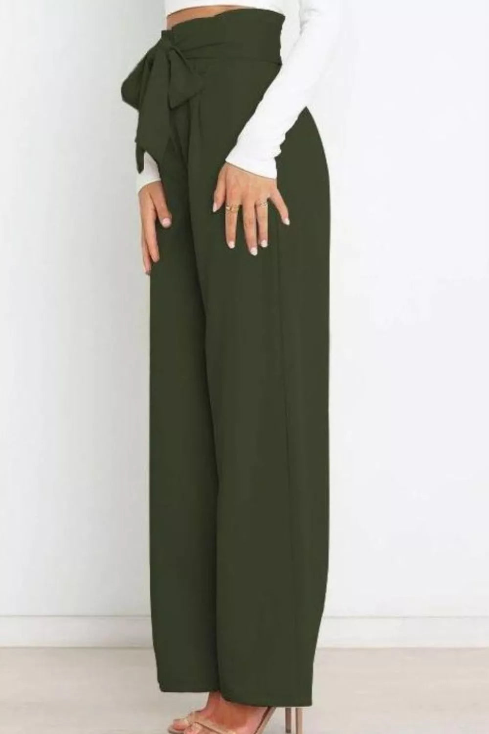 Green wide-leg pants with a tie-waist design on a white background