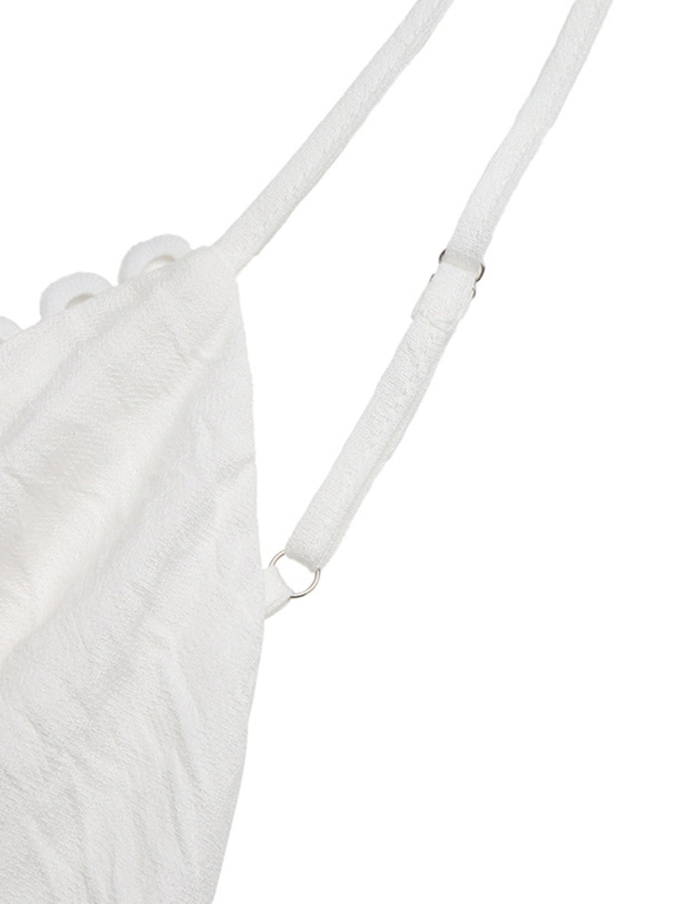 White textured bag with a strap on a white background