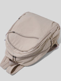 Beige backpack on a light gray background
