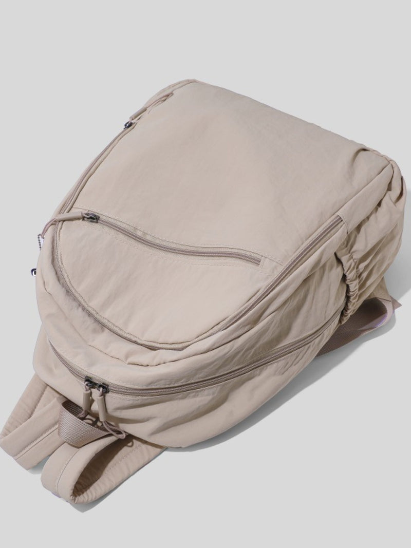 Beige backpack on a light gray background