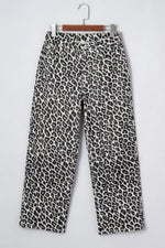 Leopard print pants on a hanger against a white background