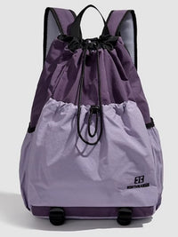 Two-toned purple and gray backpack with a brand logo on a light gray background