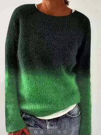 Green and black gradient sweater worn by a person on a white background