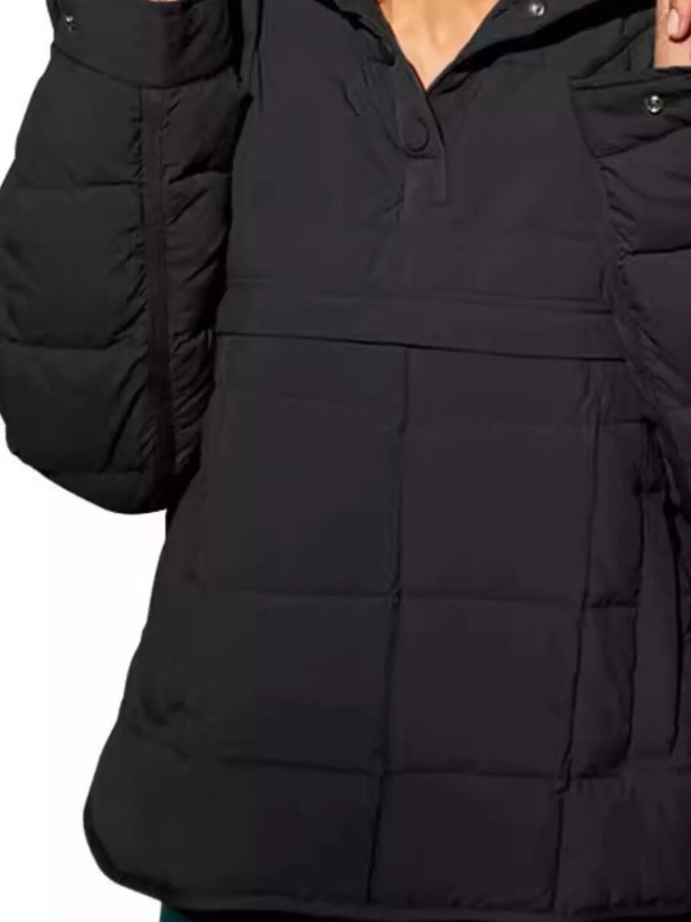 Close-up of a black puffer jacket with a hood on a white background
