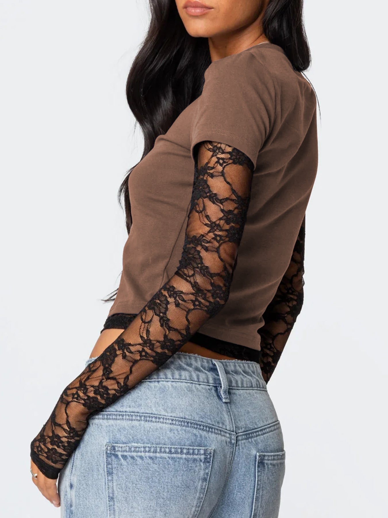 Brown long-sleeve top with lace sleeves worn by a person on a white background