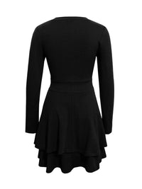 Black dress with long sleeves on a white background