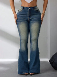 Person wearing high-waisted flared jeans on a plain background