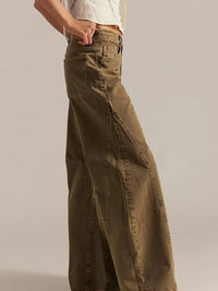 Brown wide-leg pants worn by a person on a plain background
